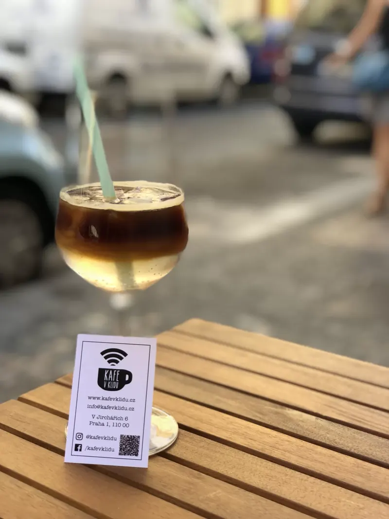 A drink on the table in front of the café